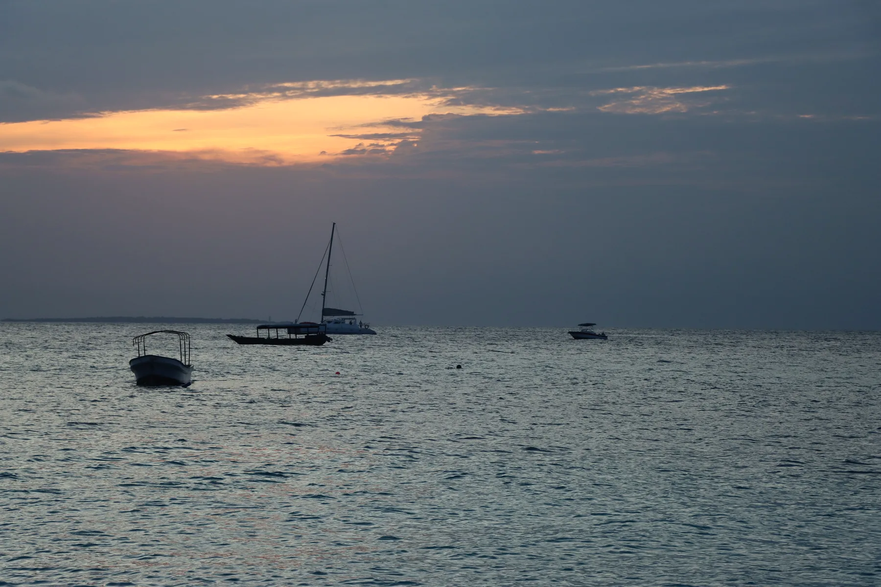 Traditional boats at sunset on Zanzibar